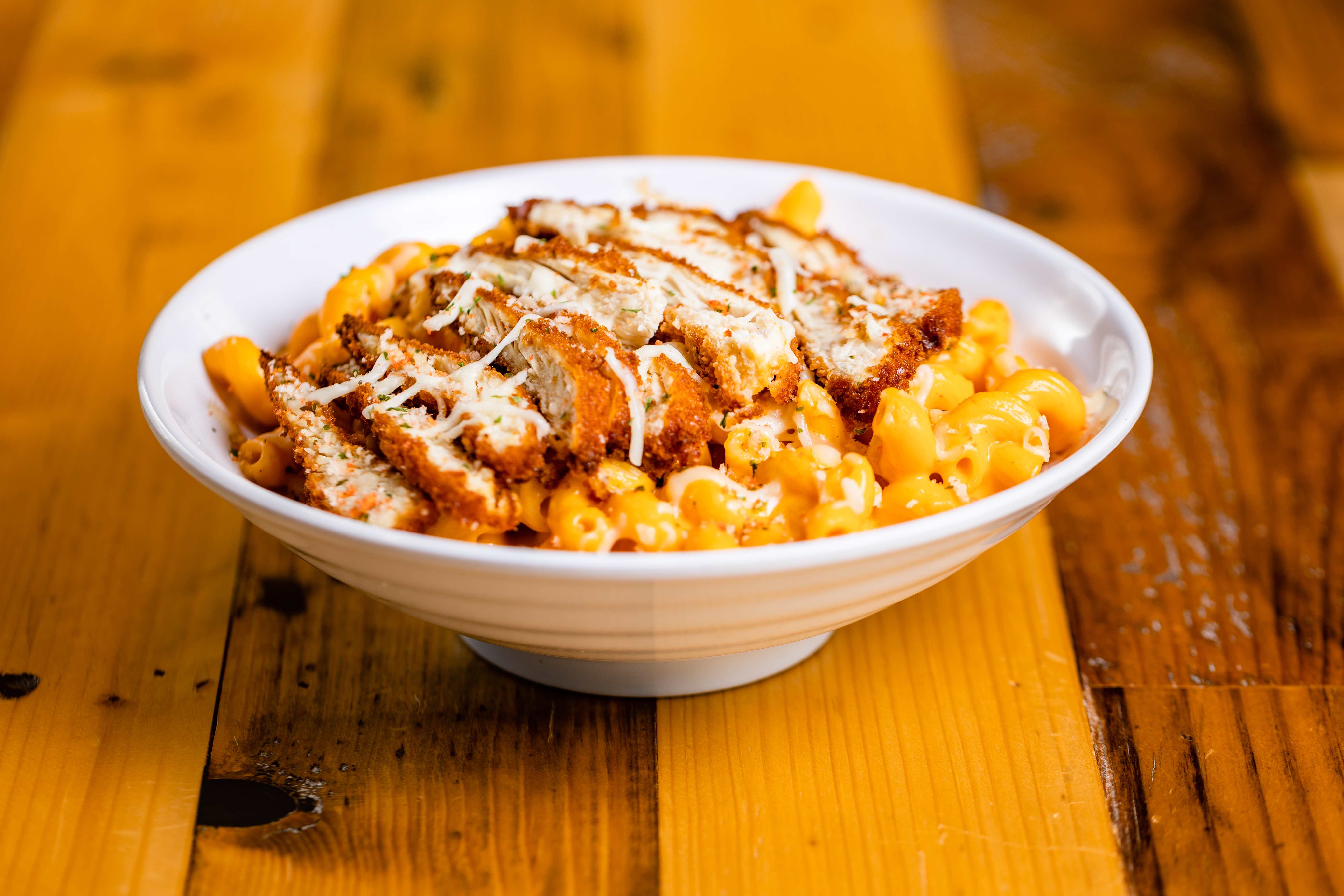Buffalo Mac N Cheese - Our signature mac & cheese, buffalo sauce & sliced...
